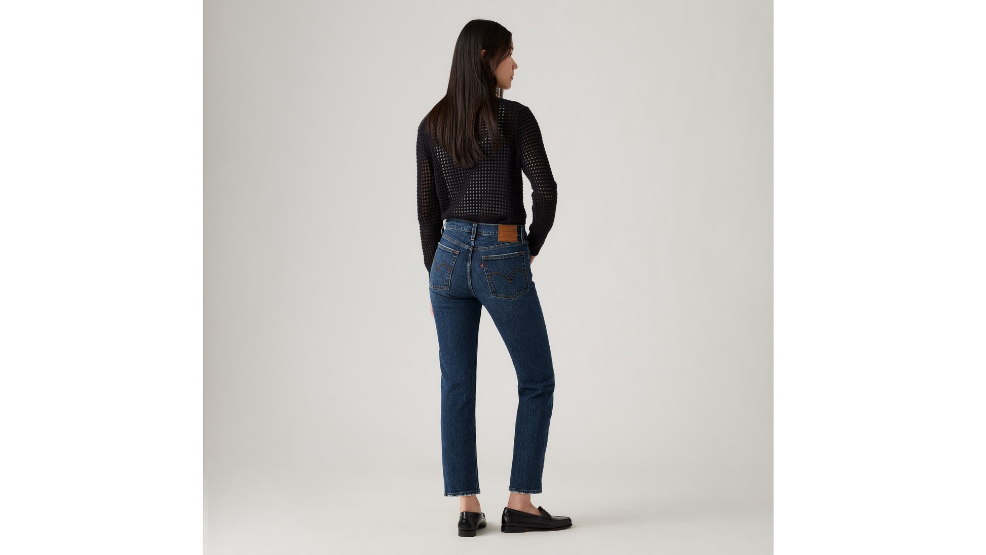 Levi's black mesh sweater and Levi's blue jeans