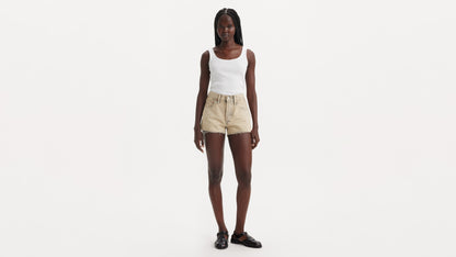 Full view beige shorts with white tank top