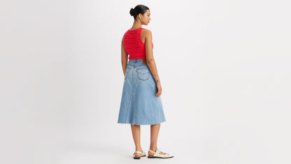 Woman in Levi's high-rise a-line skirt and red top back view