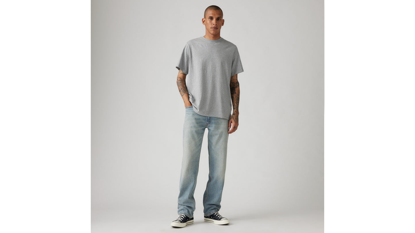 Man in Levi's grey tee and light-blue washed jeans