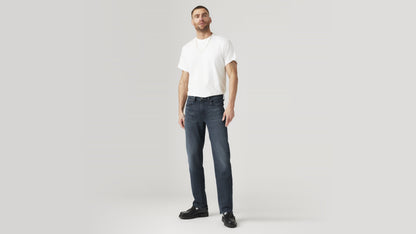 Front view of a man in dark blue Levi’s 514 straight-leg jeans and a white tee