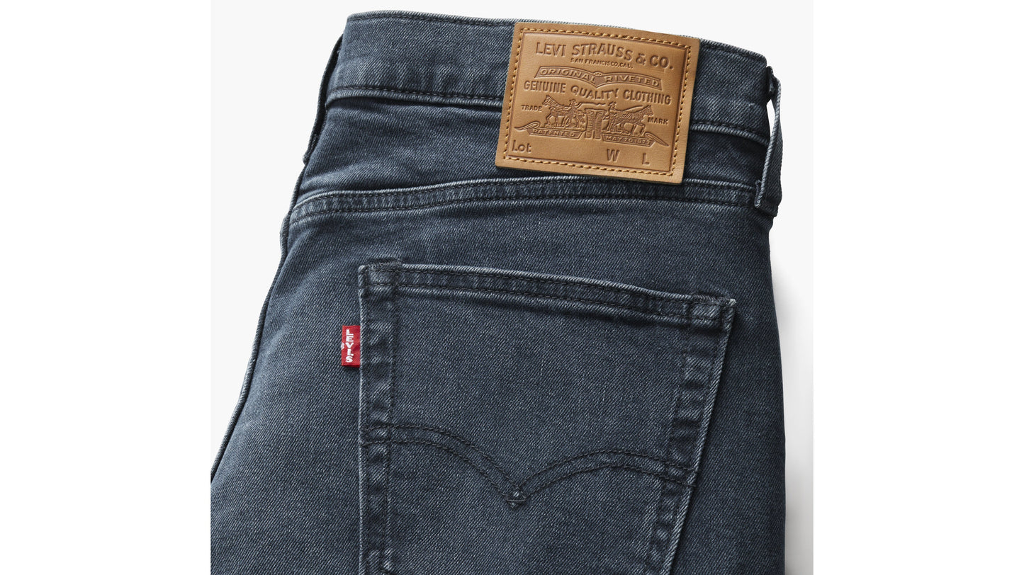 Levi’s 514 dark indigo jeans with leather patch and red tab branding
