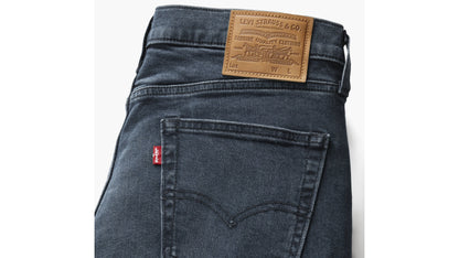 Levi’s 514 dark indigo jeans with leather patch and red tab branding