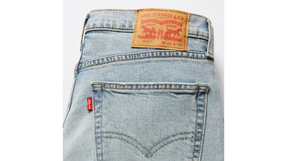 Detail of Levi's jeans waistband with leather patch & red tab on the pocket