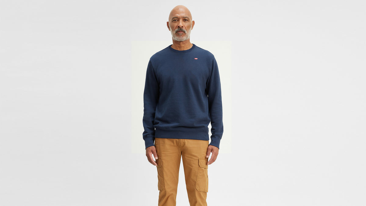 Front view of a man wearing Levi's crewneck sweatshirt, navy blue