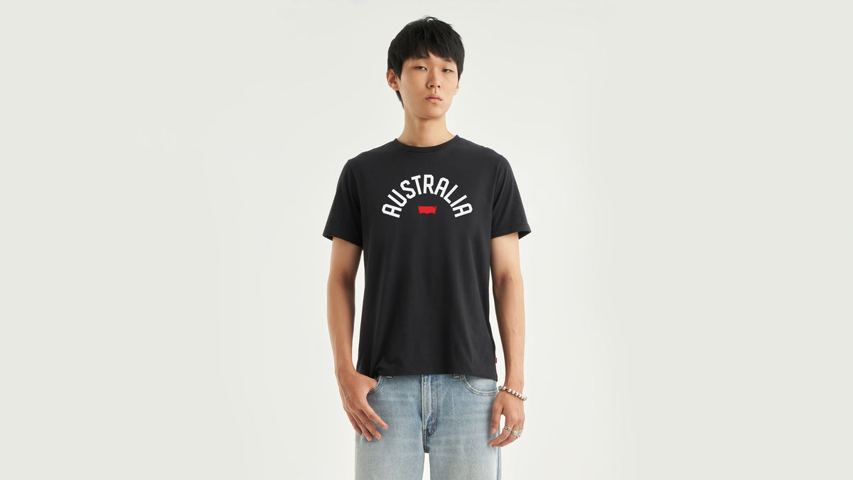 Front view of man in Black Levi's Men's Destination T-Shirt and light jeans