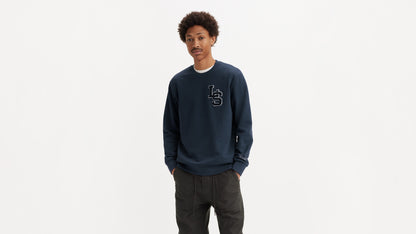 Man in navy Levi’s sweatshirt and cargo pants