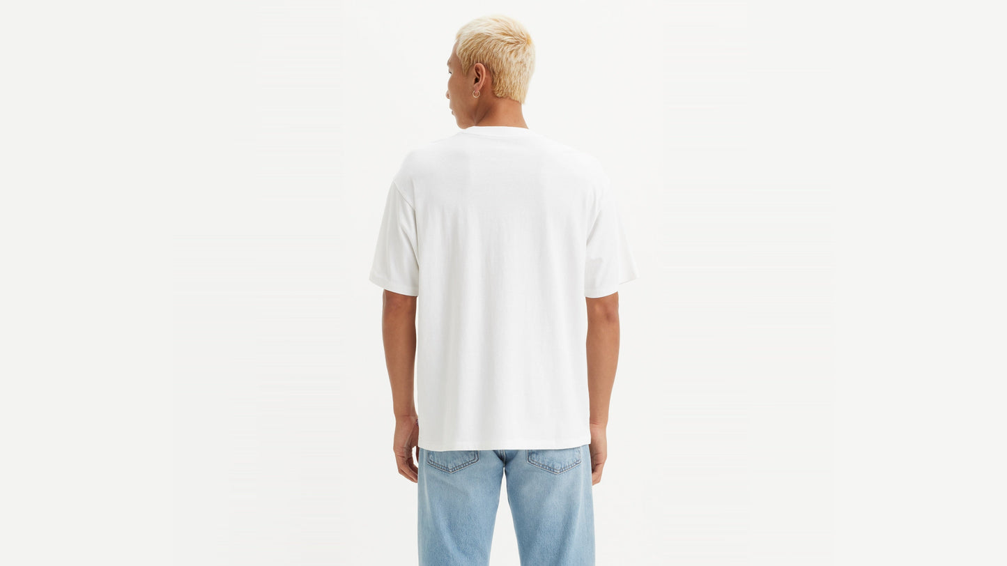 Man in Levi's White Vintage Batwing Graphic T-Shirt with light jeans, back view