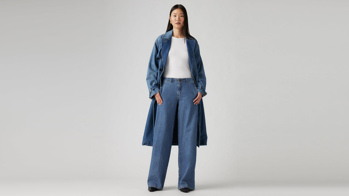 Front view of a woman wearing Levi's baggy chino jeans & a matching denim jacket