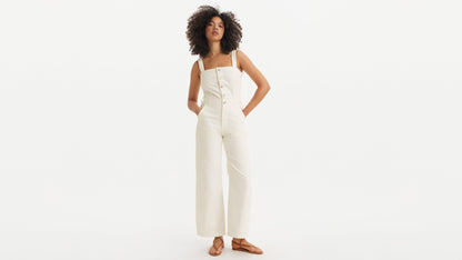 Woman in white Levi’s button-front jumpsuit