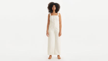 Model wearing wide-leg ivory denim jumpsuit