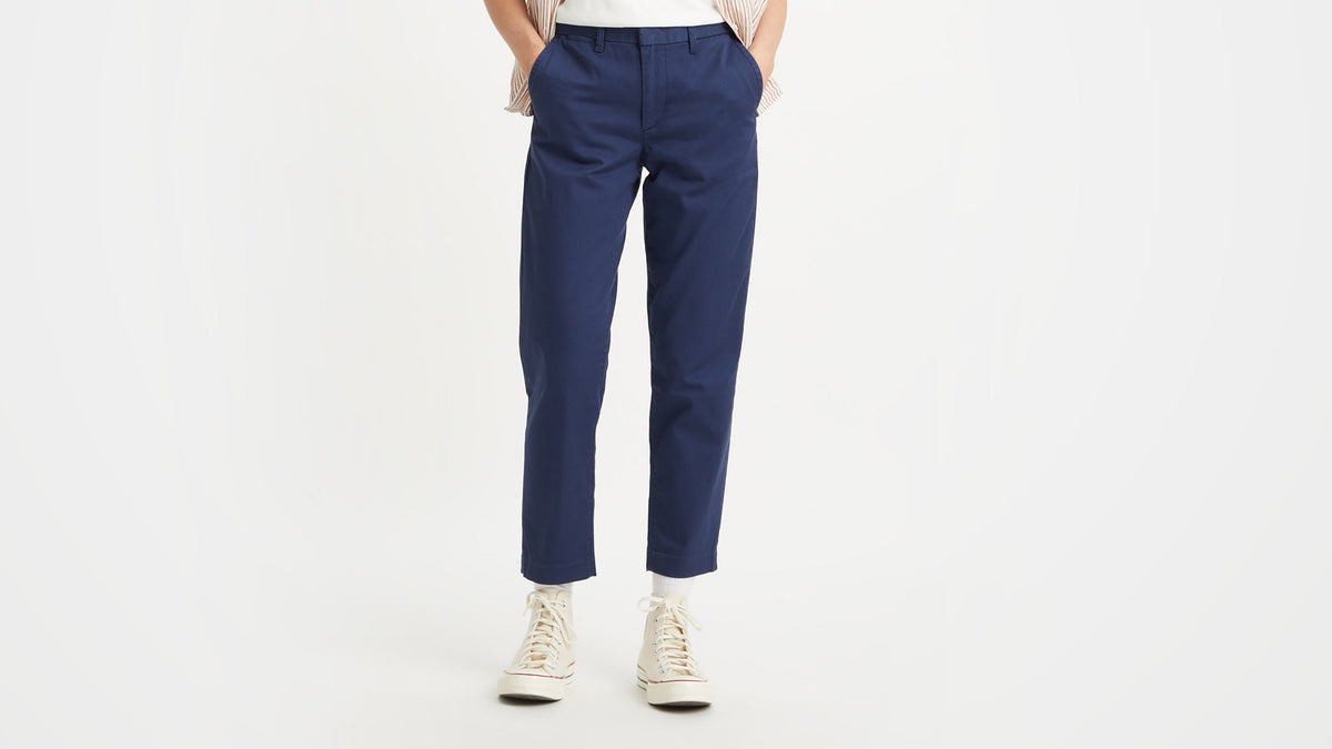 Close-up of Levi's Women's Essential Chino Pants in navy blue, styled with sneakers