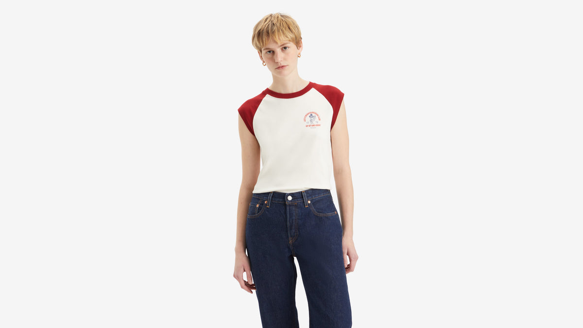 Front view of woman in Levi's white Graphic Anywear Tank with red shoulder detail