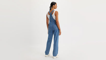 Woman in Levi’s denim overalls, back view